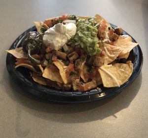 Not-chos: Chik-N, began shredded cheese, vegan sour cream, pico de Gallo, salsa at Guapo's Taco Shop in Bakersfield