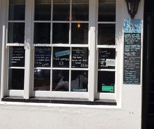 Menu items on the outside window at The Market Place in St Ives