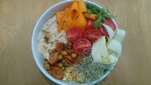 Hummus, chickpeas and carrots with cauliflower rice and vegetables at Massolit Cooks in Krakow
