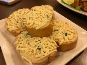 Cheese Bread! Buttery cheese bread with daiya cheese. Our family and friends love it. at Goji Cafe in Dallas