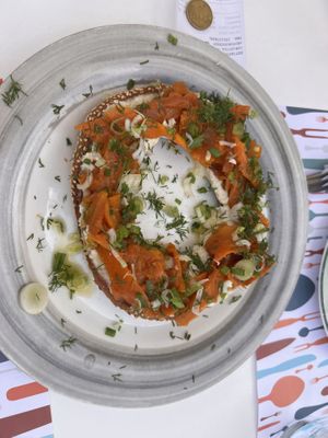 It’s a bread roll made with cashew cream, carrots and herbs on top. Super delicious!!   at Pulse in Crete