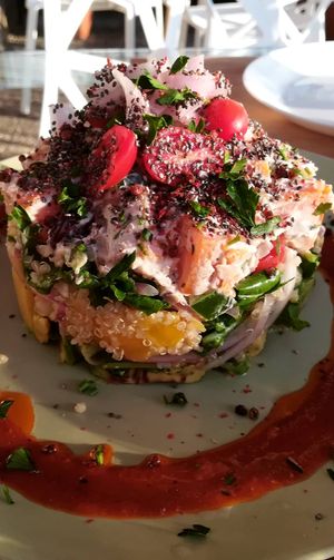 Salat with quinoa, ?, chia, fruits, special sauce, and and and at Pulse in Crete