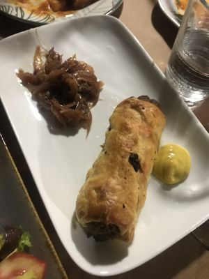 ‘Sausage’ roll with caramelised onions and mustard  at Pulse in Crete