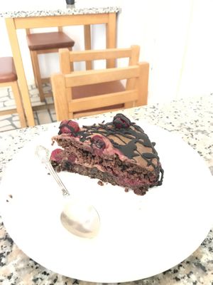 Gluten free and sugar free chocolate cake with cherry  at Paradise Food in Budva