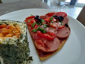 Sausage pizza slice at Paradise Food in Budva