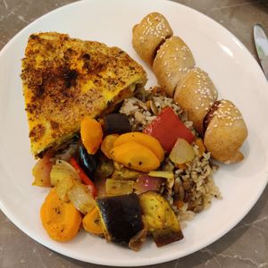 Vegan sausage roll, savoury pie, grilled veggies, rice with pumpkin seeds at Paradise Food in Budva