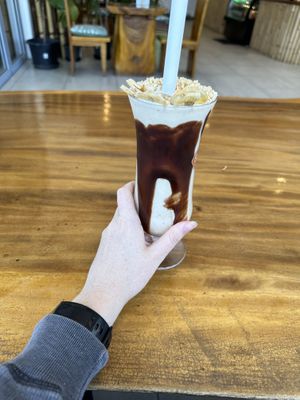 Showing you just how huge the milkshake was!  at Doko Demo V in West Burleigh