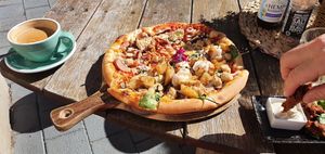 Half half pizza! Meatlovers and can't remember the other at Doko Demo V in West Burleigh