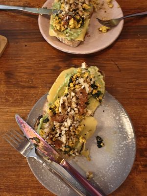 Toast with scrambled tofu, cheese, avocado snd walnuts at La Tienda de Los Unicornios in Granada