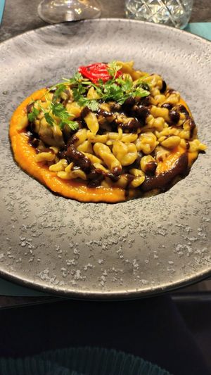 vegan gnocchi with porcini mushrooms & black garlic on a pumpkin cream sauce & crispy chips at Ristorante Lo Stornello in Stresa