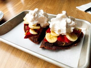 Vegan chocolate waffles with whipped coconut cream, banana, PB and strawberry at The Game Parlor in San Francisco
