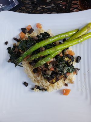 Grilled avocado with pilaf. Made vegan with no cheese. at Mosaic Tapas in Ocean Springs