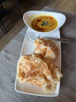 Roti and yellow lentil curry  at Fat Choi in Toronto