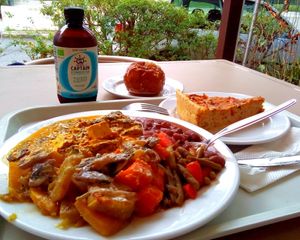 Delicious curry tofu with mushroom sauce, vegan pie and baked apple at Celeiro - Roma in Lisbon
