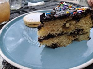 Vanilla cake with apple and chocolate ganache. And Alfajor con mermelada de moras. at Capra in San Jose