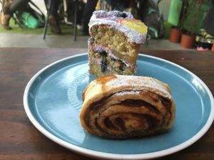 blueberry and lemon cake and cinnamon roll at Capra in San Jose