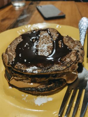 Banana pancakes with pb and chocolate sauce. So good!  at Capra in San Jose