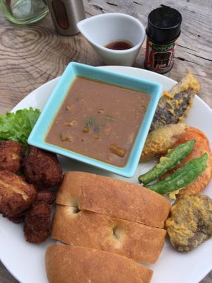 Fried soymear, curry, tempura vegetabes, bread. at Marugoto Vegan Dining Asakusa in Tokyo