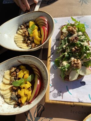 Two small bowls of açai + veggie tahini sandwich at Byoko in Malaga