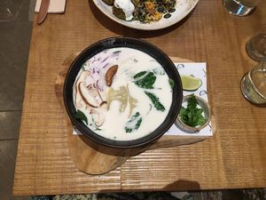 Thai Bowl Veggie Soup with noodles, gyozas, mushrooms, cherry tomato, spinach, coriander, Thai spices in a vegetable soup made from coconut milk. at Byoko in Malaga