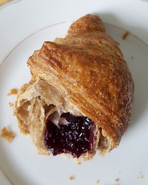 Vegan croissant filled with elderberry jam - closeup at Nah am Wasser - Neukölln in Berlin
