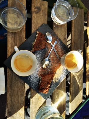 Coffee with small piece of complimentary peanut butter chocolate cake at La Table à l'Envers in Marseille