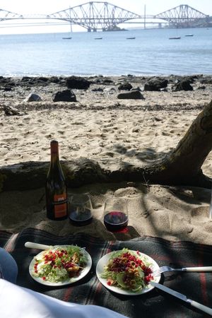 Sprout, pomegranate and walnut salad; wine and glasses; beach. at Wedgwood in Edinburgh
