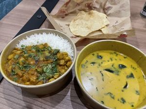 Channa masala bowl with plain rice, house special curry and a poppadam, ordered through foodpanda. With a foodpanda promotion, it was delivered (in less than 20 mins) for $8.60.  at Masala Dosa Street Kitchen - MDSK in Phnom Penh