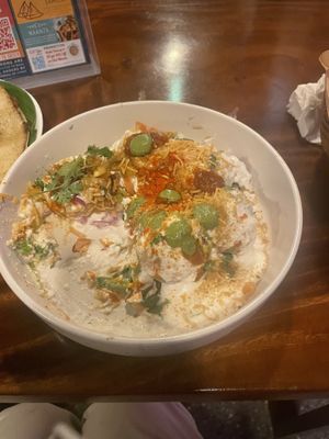 Dhaipuri: sev, puri, potatoes, onion, chili powder, chickpeas, vegan yogurt curd, coriander  at Masala Dosa Street Kitchen - MDSK in Phnom Penh