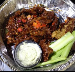 General Tso seitan wings - carry-out (the buffalo wings come like this too) at The Belgian Cafe in Philadelphia