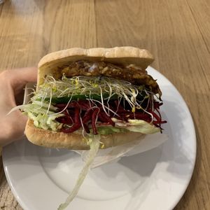 The millennium burger on a gluten free bun at Pilgrims Vegetarian Cafe in Corrimal