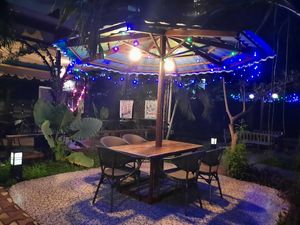 Beautiful outdoor dinning area at night. at Loving Hut in Kinshasa