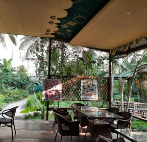 Comfortable dining area with nature. at Loving Hut in Kinshasa