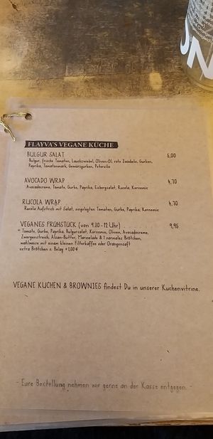 Vegan Menu (Bulgursalad, Wraps and vegan Breakfast). Vegan cakes can be found in the cake display case at Flayva Coffee & Tea Lounge in Dortmund