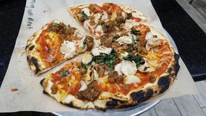 Vegan pizza with cheese and faux-meat at EddieWorld in Yermo