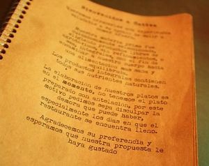 A message on the first page of the menu warning about the organic, integral and slow food that they serve. at Sattva 2 in Buenos Aires