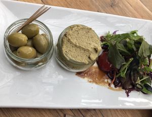 Cumin, garlic and butter bean houmous, salad and garlic stuffed olives at The Garlic Farm in Sandown