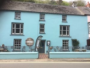 Look for the blue shop - a few doors down from the main carpark (pay and display) at MamGu Welshcakes in Harverfordwest