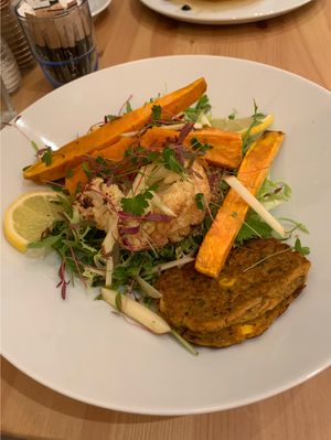 Roasted cauliflower and sweet potato salad with quinoa and a zucchini fritter.  at Cafe No 11 in Rayleigh