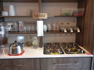 Sauce station with free tea and water at Surely Up Vegetarian Hotpot in Richmond Hill