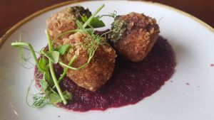 Tomato arancini on a roasted beetroot & balsamic purée with basil pesto at The Snowy Owl in Cramlington