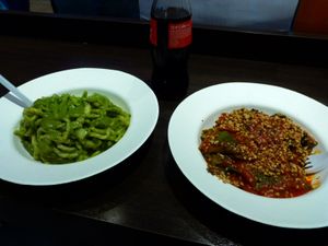 trofie with pesto sauce and spinach ravioli with tomato sauce and hazelnuts at Pastificio Artigianale di Canneto in Genoa