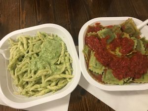 Trofie with pesto sauce and ravioli with tomato sauce at Pastificio Artigianale di Canneto in Genoa
