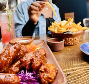 Chicken wings and fries were the best!   at Om Sabor in San Francisco