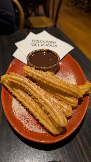 Churro fries $7.95 with classic dark chocolate $?: sauce was surprisingly really good, creamy not too dark at San Churro  in Glebe