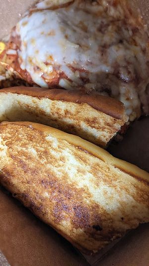 vegan lasagna with garlic bread at Ethos Vegan Kitchen in Winter Park