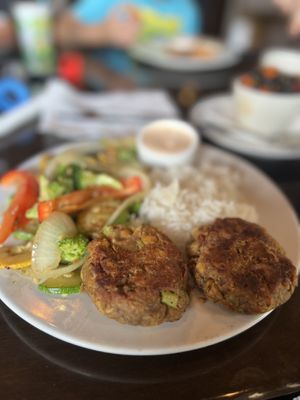 Bay cakes ( made from chickpeas ) “crab cake” with jasmine rices, sautéed veggies and Mayo based sauce   at Ethos Vegan Kitchen in Winter Park