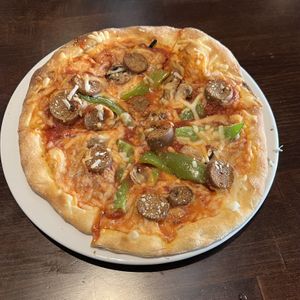 sausage mushroom green pepper pizza  at Ethos Vegan Kitchen in Winter Park