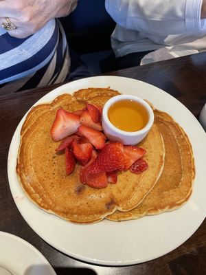 Short stack of banana pancakes with added strawberries and agave (can also order with maple syrup) off their brunch menu   at Ethos Vegan Kitchen in Winter Park