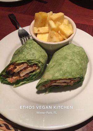 Buffalo Chickun Wrap with fresh fruit (pineapple) at Ethos Vegan Kitchen in Winter Park